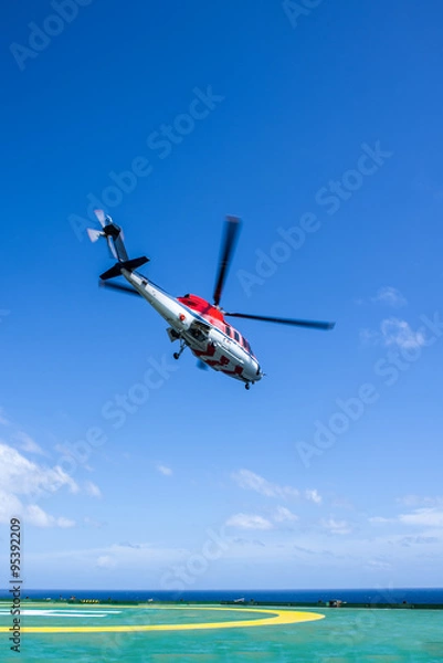 Obraz Helicopter take off from oil rig