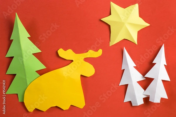 Obraz Christmas paper figures made by children, on red paper sheet