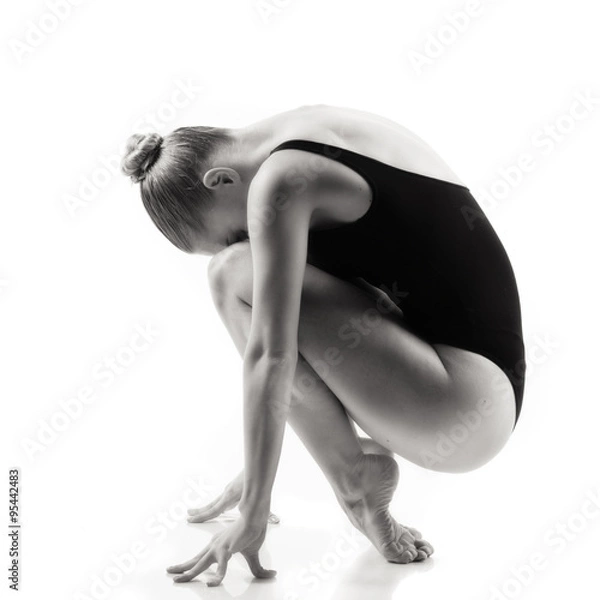 Fototapeta Modern ballet dancer posing on white background