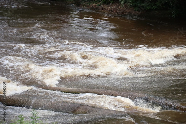 Obraz water flowing into the river