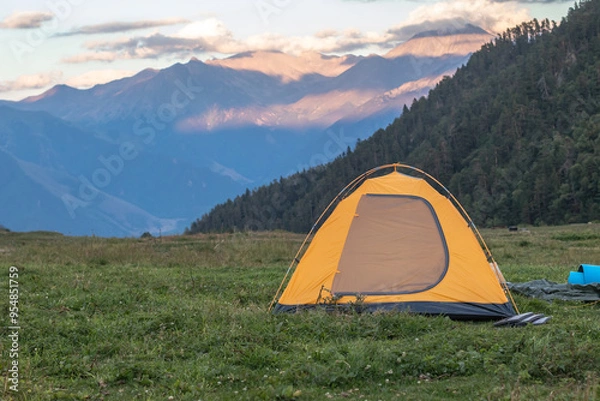 Obraz Yellow tent on the background of the mountains