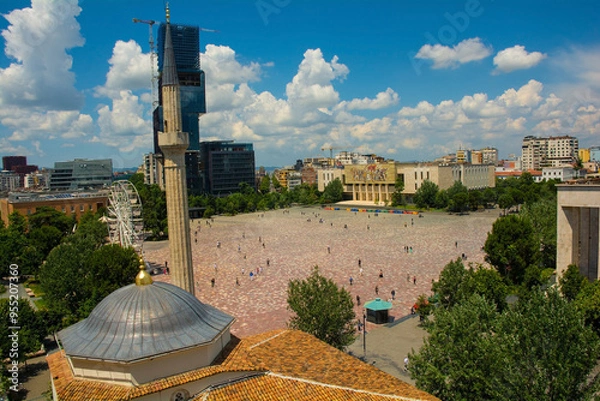 Fototapeta Skanderbeg Square in Tirana, Albania, viewed from the top of Clock Tower over the roof of Ethem Bey Mosque. National History Museum with the iconic Albanians mosaic is centre,Eyes of Tirana skyscraper