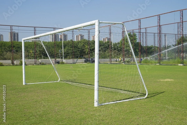 Fototapeta Soccer goal with net. Football goal on the field.