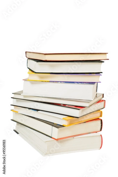Fototapeta Pile of books with different colors of covers and white background