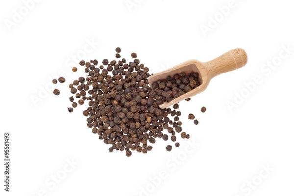 Fototapeta schwarzer Pfeffer auf weissen Hintergrund mit Holzlöffel