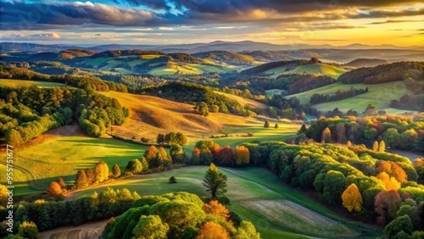 Fototapeta Bird's-eye view of a sprawling auburn-hued landscape, rolling hills and trees, soft focus, expansive atmosphere, serene mood, a realistic photo image.