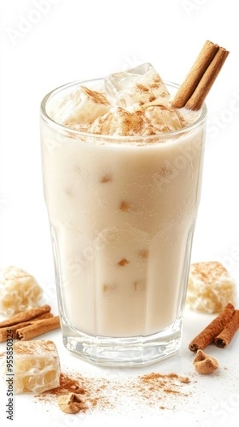 Fototapeta Iced Cinnamon Drink with Ice Cubes and Cinnamon Sticks