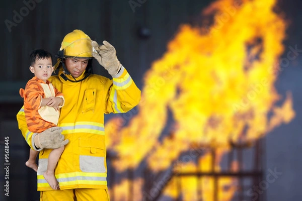 Fototapeta firefighter, fireman rescued the child from the fire
