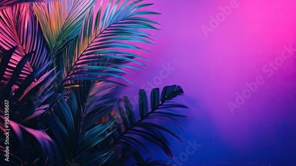 Obraz Tropical palm leaves photo in neon light, exotic background.