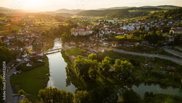 Fototapeta Zuzemberk Castle and medieval village on the river Krka in Slovenia. Aerial drone view