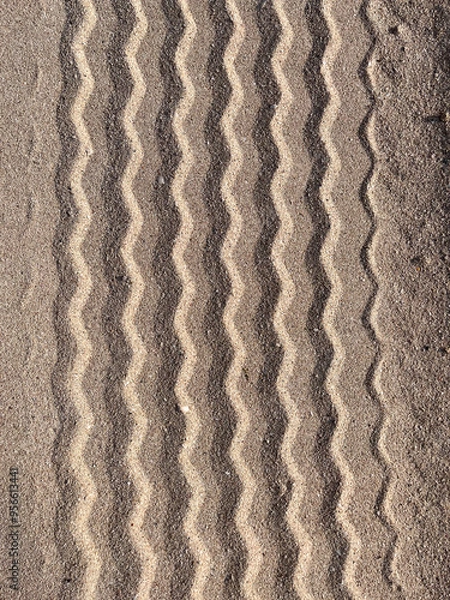 Fototapeta Tire tread marks on the sand, straits imprints from wheels on the surface of the dunes