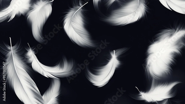 Fototapeta Flying white bird feathers on black background in smoke with blurring effect. Plumage wild animal, birds elements. Stylish decorative background