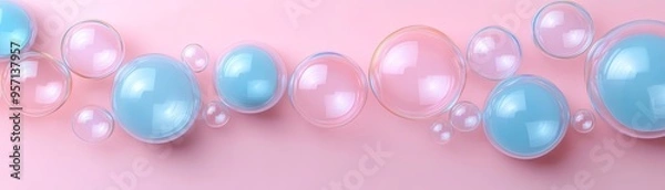 Fototapeta Aesthetic arrangement of pink and blue soap bubbles on a soft pink background, creating a whimsical and calming visual effect.