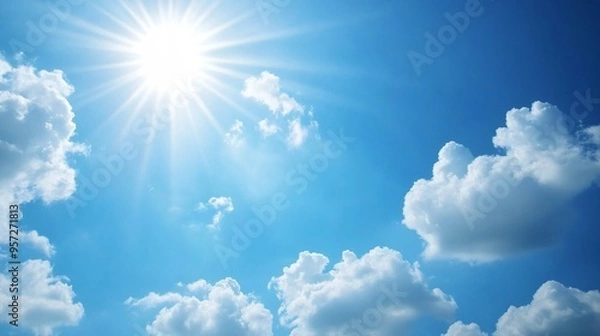 Fototapeta Clear blue sky with a few white clouds, serene weather, bright sunlight