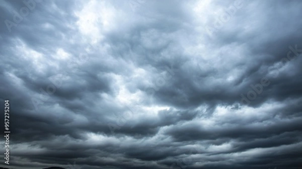 Fototapeta Overcast sky with dark clouds threatening rain, gloomy weather, moody atmosphere