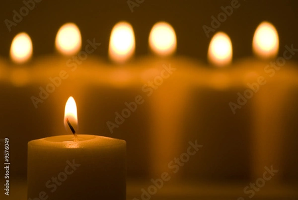 Fototapeta Warm glowing candles in a group