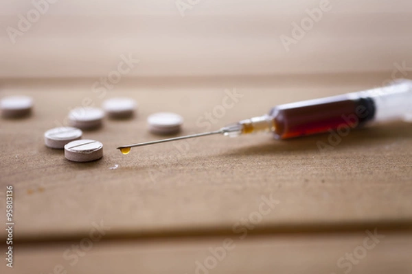 Obraz Syringe on a table