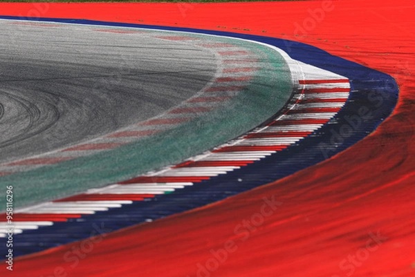Fototapeta Race track. A high-speed corner of race ring during the day.