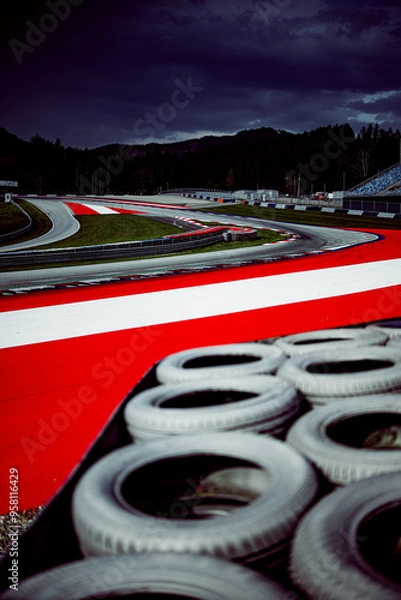 Fototapeta Race track. A high-speed corner of race ring during the day.