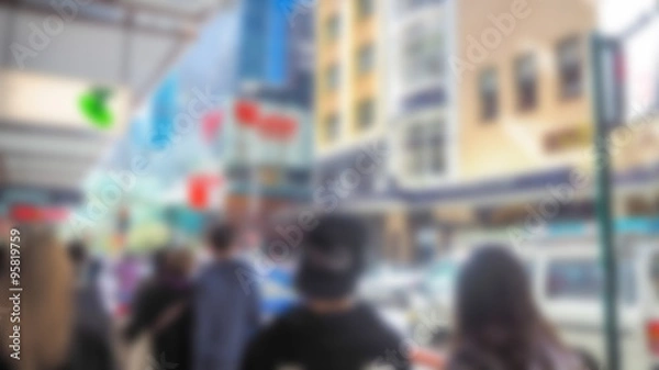 Fototapeta Abstract blur Crowd of anonymous people walking on busy  street