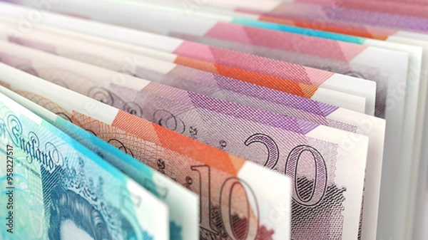 Fototapeta Close-up view of British pound banknotes in different denominations, emphasizing UK currency and finance