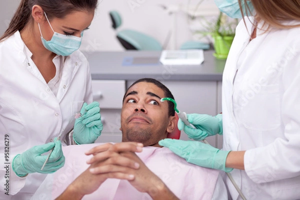 Obraz dentist curing a girls teeth