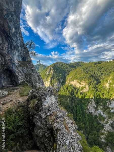 Obraz landscape with sky,  the natural arch Sura Haiducilor, Baia de Fier, Gorj, Romania 