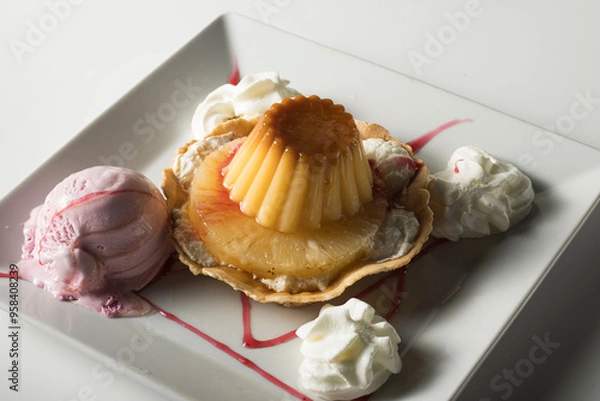 Obraz Flan sobre piña con helado de fresa  nata montada