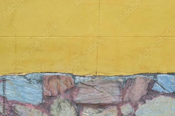 Fototapeta Yellow wall with stone texture