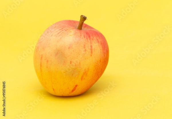 Obraz ripe apple on a yellow background