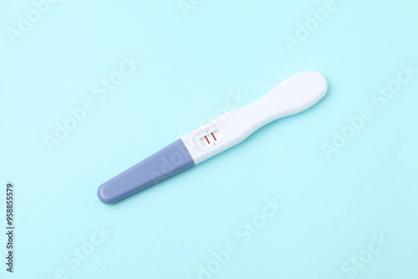 Obraz One pregnancy test on light blue background
