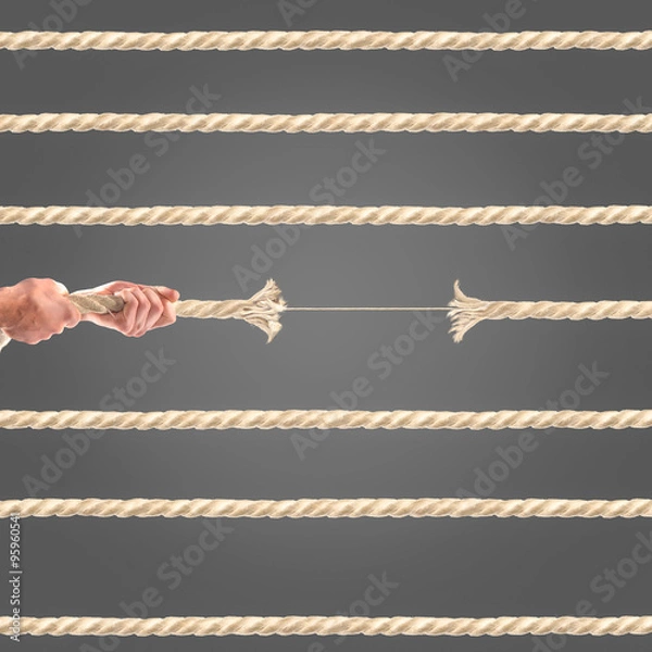 Fototapeta Hands of people pulling the rope on black background. Competition concept