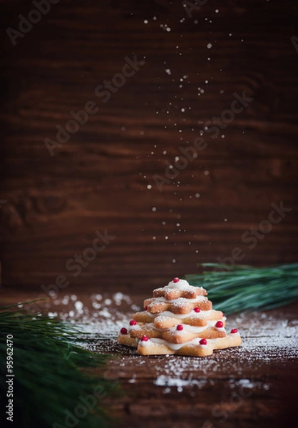 Obraz Keksbäumchen auf dunklem Holz