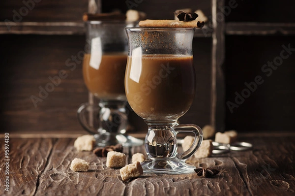 Obraz Hot american coffee with cinnamon on the vintage table