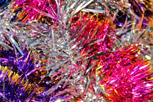 Fototapeta Festive multi-colored background with Christmas tinsel