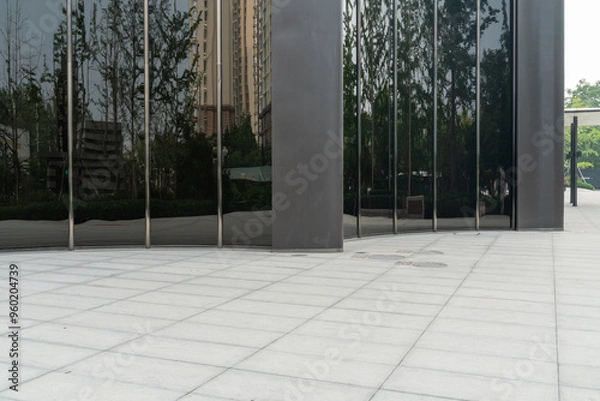 Fototapeta empty concrete ground in front of modern office buildings in downtown. floor for copy space