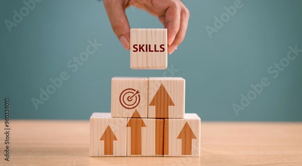 Obraz Skill individual development concept. Up new ability skill for business technology evolution. Worker learning upskill. Hand hold wood cube on digital skill icon. Competency training, education concept