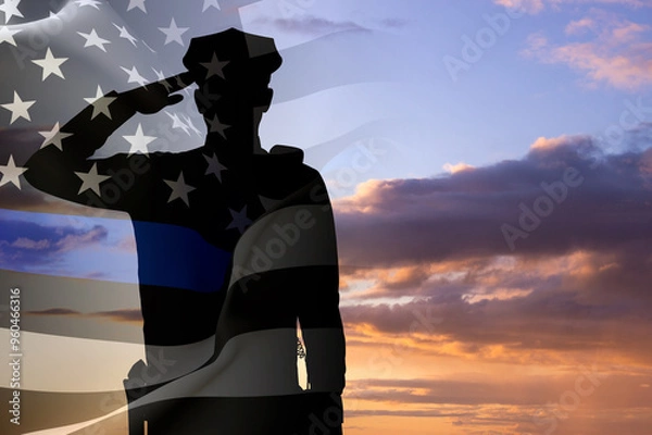 Obraz Silhouette of a police officer against the sunset. American flag with police support symbol. Thin blue line. National Law Enforcement Appreciation Day concept
