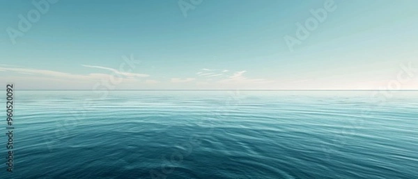 Fototapeta A vast expanse of calm ocean with a clear horizon, meeting a cloudless blue sky