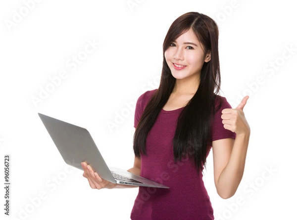 Fototapeta Asian Woman use of the notebook computer and thumb up