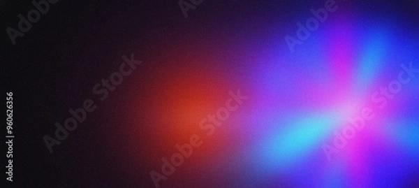 Fototapeta Grainy textured abstract background with red and blue lights blending on a dark backdrop