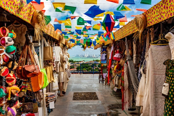 Obraz Brazilian street with shops for tourists in Olinda with a view of the city of Recife in the background