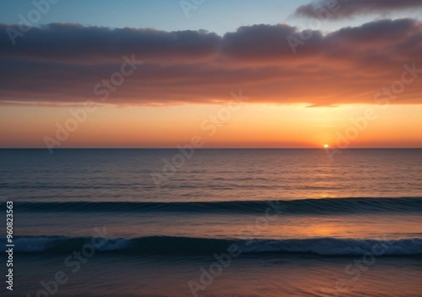 Fototapeta Sunset Over Calm Ocean Waves
