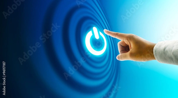 Fototapeta Hand press power button on touch screen