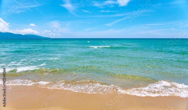 Obraz Azure sea waves on the sand beach.