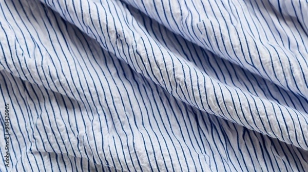 Fototapeta Seersucker fabric made from a silk-cotton blend, provides a light with comfortable feel. Its puckered texture makes it ideal for hot weather, combining style and breathability.