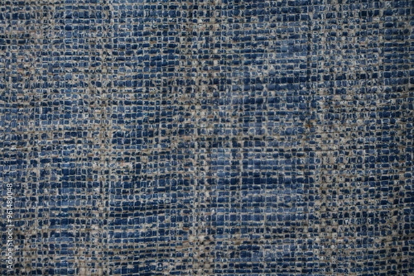 Fototapeta Blue grungy background with light shade tent surface, Rugged uneven material texture backdrop design, stripped particle weathered blue tent background
