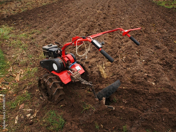 Obraz Motor Plow In Front Of Tilled Ground
