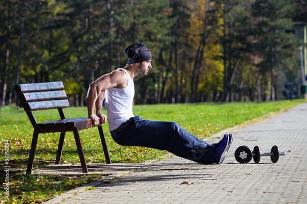Obraz man exercise on street bench