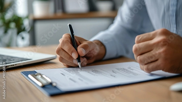 Fototapeta Man Filling Out Passport Application at Office
